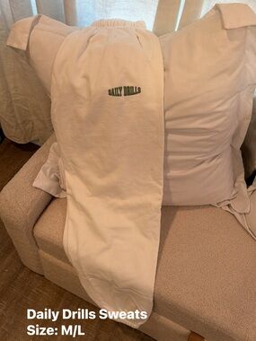 Daily Drills Cream Sweatpants with Green Logo